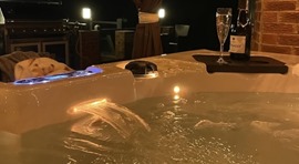  Hot tub with a bottle of bubbly