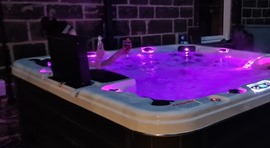Hot tub with purple lighting